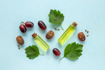 Bottles of grape seed essential oil. Massage body care cosmetic product