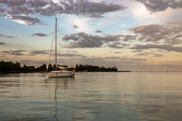 Sailboat moored in lake Balaton at sunset