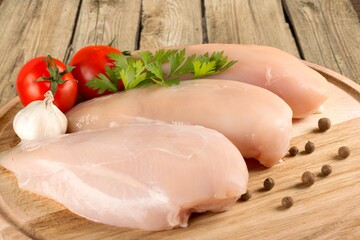 Fresh raw chicken meat parts on the desk