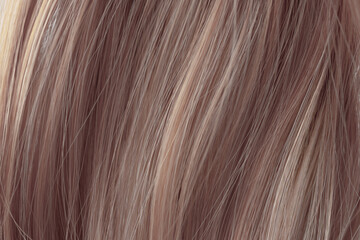 Brown curly hair texture closeup. Light brown hair background.