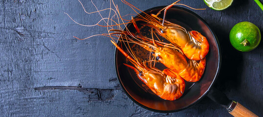 Cook seafood shrimp in a pan.