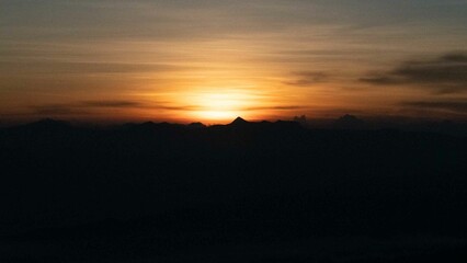 The sun is rising or setting on the horizon