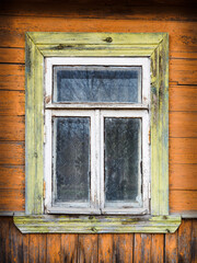 Old wooden house window orange yellow