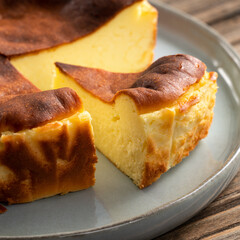 Delicious sliced baked Basque Burnt Cheesecake in a plat served for eating.