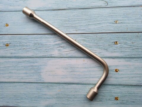 Wrench , isolated on wooden table.