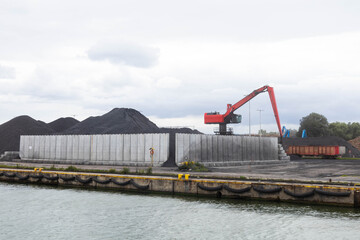 coal unloading in polish shipyard, coal shortage Mountains of coal on the territory of the Poland Commercial Sea Port. The unloading of wagons 