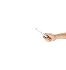 Male caucasian hand holding a white and silver electric toothbrush, on the right side of the frame, isolated on white