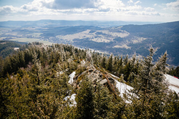 Dolni Morava, Czech Republic, View from in clouds, tourist attraction, landscape with forest and sky on mountains at sunny day, Skywalk with snow, Coniferous trees, spruce branches in winter