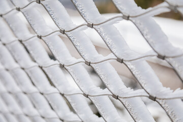 Dolni Morava, Czech Republic, 16 April 2022: Path in the clouds, tourist attraction with spiral platform to observation tower, landscape with forest and sky on mountains, Skywalk with snow