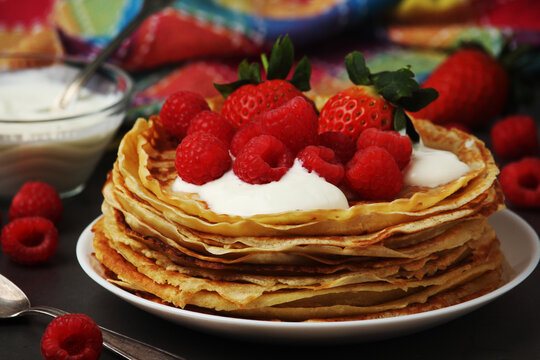 Russian cuisine national dish bliny with fresh berries	