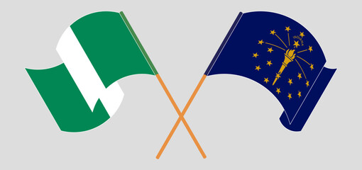 Crossed and waving flags of Nigeria and the State of Indiana