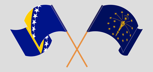 Crossed and waving flags of Bosnia and Herzegovina and the State of Indiana