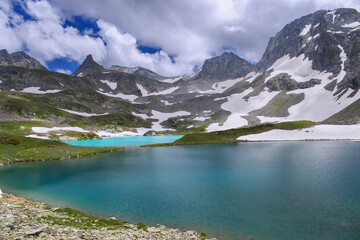 Soft focus. Lake with turquoise water in a mountain valley. Shooting at a wide angle.