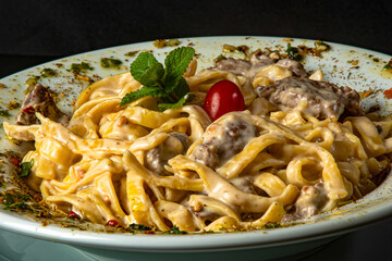 four cheese pasta with filet mignon escalope.