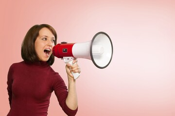 Exultant happy young woman hold scream in megaphone announces discounts sale