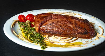 grilled picanha served with salad and cream.
