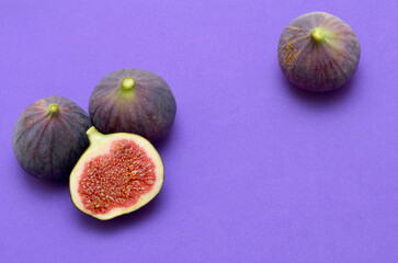 colorful background figs on purple background closeup