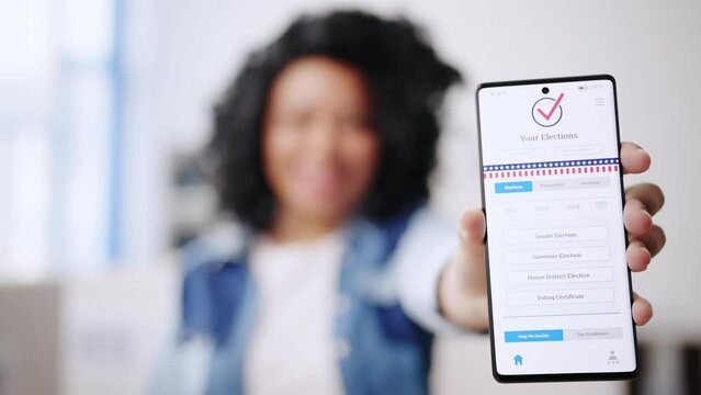 Closeup of African American woman showing app for online voting, decision