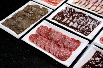 Shabu meat on a white tray
