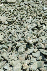 scattered sulfur stones in the sun