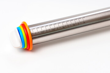 Metal rolling pin with thickness adjustment for rolling out the dough.