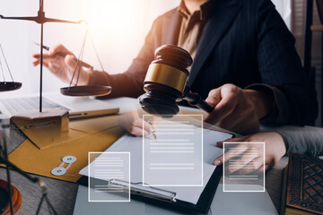 Male lawyer working with contract papers and wooden gavel on tabel in courtroom. justice and law ,attorney, court judge, concept.