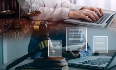 Male lawyer working with contract papers and wooden gavel on tabel in courtroom. justice and law ,attorney, court judge, concept.