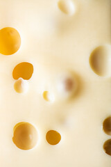 French emmental semi-hard cheese background.