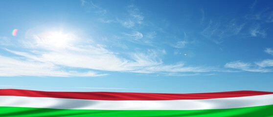Hungary flag on blue sky background