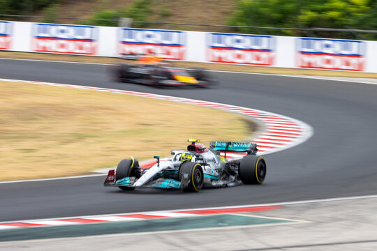 2022 Formula 1 Car at the Hungarian Grand Prix Race - Mercedes and Red Bull - Lewis Hamilton leads Max Verstappen  - Race Day - Cornering - Motion Blur - Mid