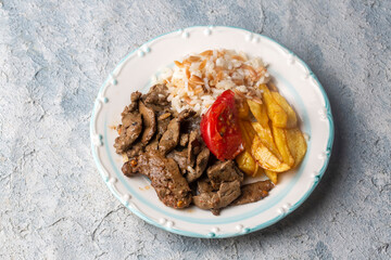 Liver pan (Albanian liver) Turkish traditional food. Liver over rice. (Turkish name; arnavut ciger)