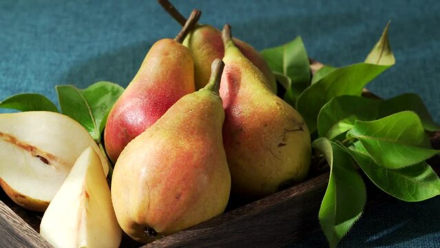 Fresh eggplant pears on blue background