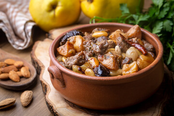 Traditional delicious Turkish foods; Quince and plum lamb stew, lamb tandoori (Turkish name; Ayvali...