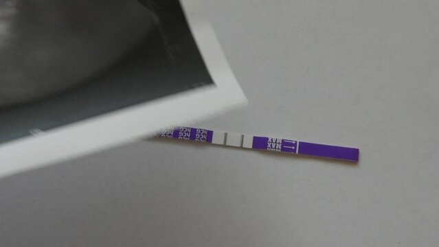 hcg pregnancy test and photos of the baby from the screening
