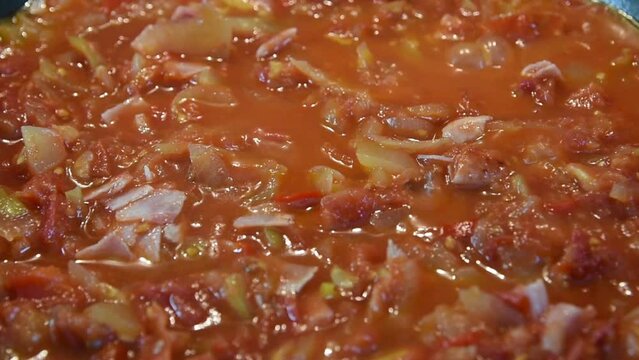 bubbling the vegetable mixture. cooking lecho.