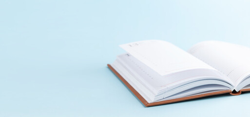 Notepad over blue background