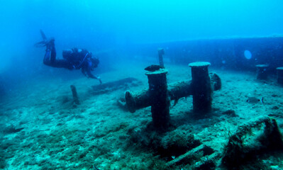 Shipwreck scenery underwater,  deep blue water ocean scenery of metal underwater.