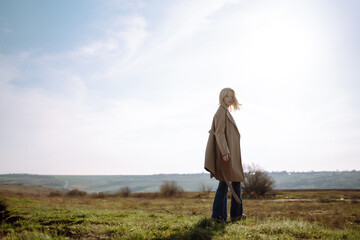 Young woman resting in nature. People, lifestyle, relaxation and vacations concept. Fashion, style concept.