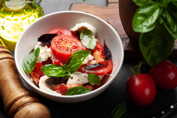 Caprese salad with fresh tomatoes, basil and mozzarella cheese