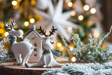 Happy New Year 2023. Christmas card with cute reindeer on a beautiful bokeh background. New Year's...