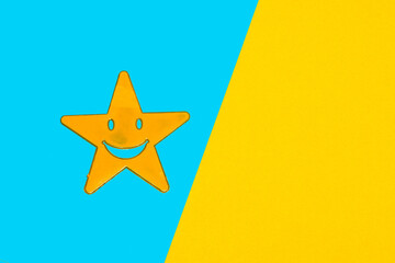 yellow star on blue part of blue-yellow background, creative art design, copy space, abstract idea
