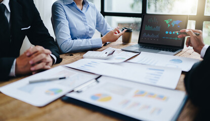 business partnership coworkers analysis strategy with discussing a financial planning graph and company budget during a budget meeting in office room.