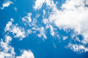 Whispy white clouds in blue sky