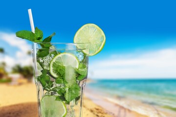 Tasty drinks with blur beach and sunset in background