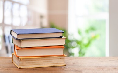 A simple composition of many books, stack or pile of books on wooden table concept