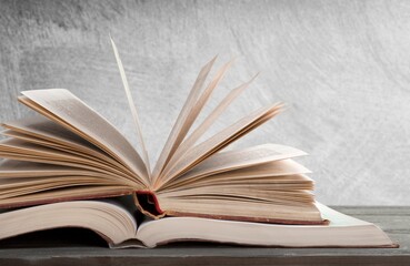 A simple composition of many books, stack or pile of books on wooden table concept