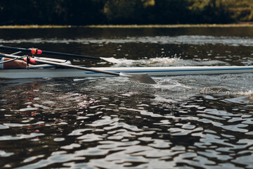 Sportsman single scull man rower rowing on boat. © primipil