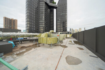 Chiller tower or cooling tower on rooftop of a office building in urban city. System work....