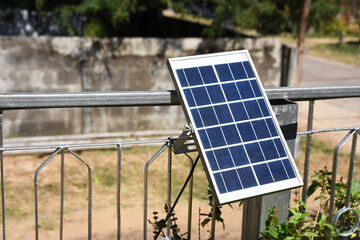 Solar panel on steel fence . solar energy