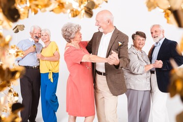 Elegant senior couple dancing during birthday party